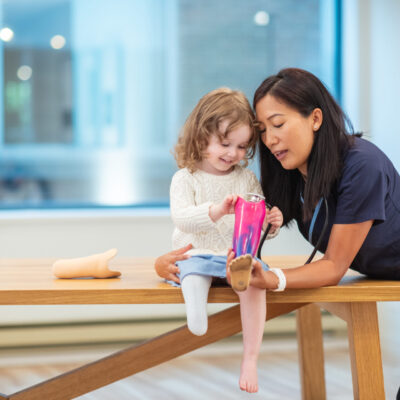 physical therapist with a pediatric patient